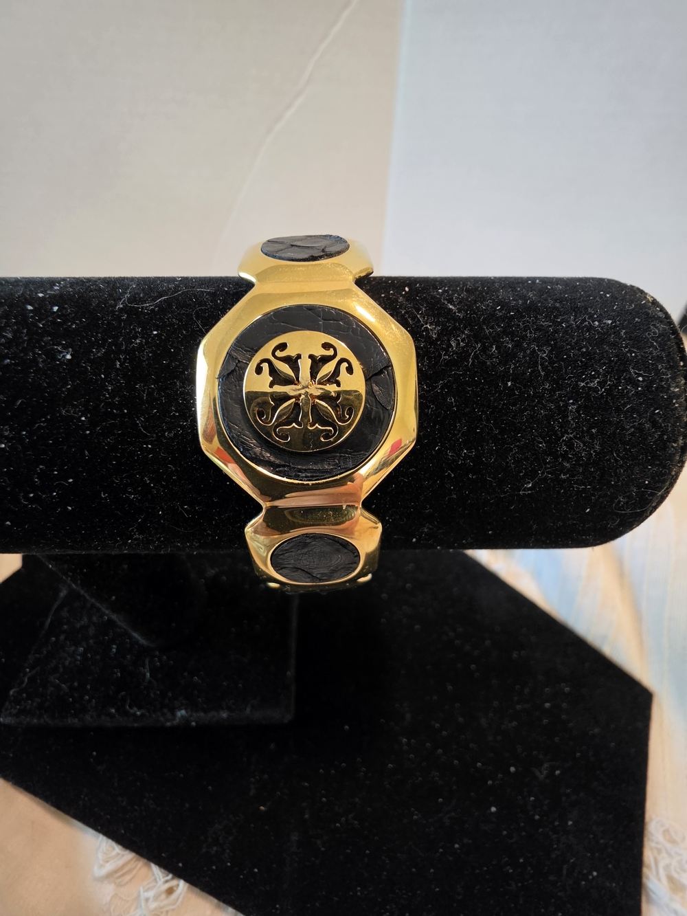 Gold-Tone Cuff Bracelet with Black Leather Medallions